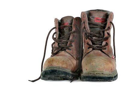 simsearch:400-05253747,k - Dirty old brown leather steel toe capped workmans boots covered in mud, against a white background. Photographie de stock - Aubaine LD & Abonnement, Code: 400-06133581