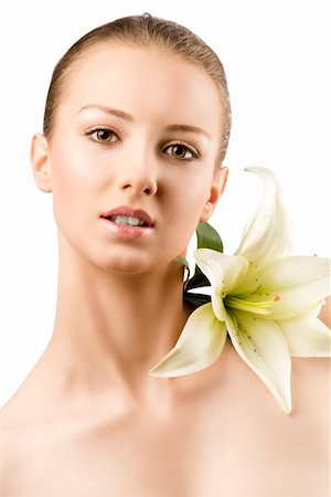 simsearch:400-06096871,k - beauty portait of pretty young girl with lilies, she is in front of the camera, looks in to the lens and smiles Stock Photo - Budget Royalty-Free & Subscription, Code: 400-06140206