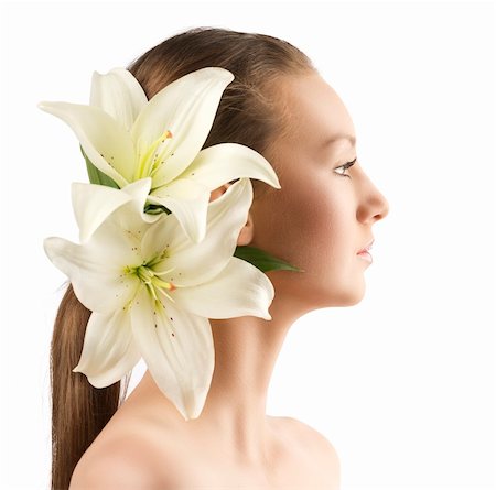 simsearch:400-04323317,k - beauty portait of pretty young girl with lilies, the girl is turned in profile at left and has lilies in the hair near the right ear Stock Photo - Budget Royalty-Free & Subscription, Code: 400-06140215