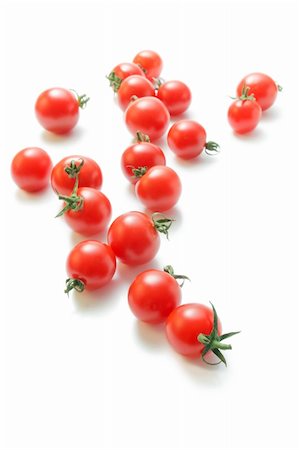 simsearch:400-04753423,k - Fresh ripe cherry tomatoes scattered isolated on white background. Photographie de stock - Aubaine LD & Abonnement, Code: 400-06140664