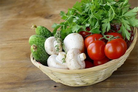 mushrooms, cucumbers, tomatoes and herbs in a basket Stock Photo - Budget Royalty-Free & Subscription, Code: 400-06140779