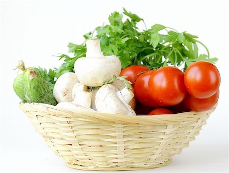 mushrooms, cucumbers, tomatoes and herbs in a basket Stock Photo - Budget Royalty-Free & Subscription, Code: 400-06140780