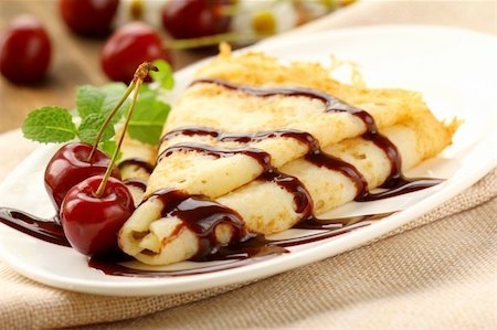 pancake bake - Sweet pancake with chocolate sauce and cherries Stock Photo - Budget Royalty-Free & Subscription, Code: 400-06140783