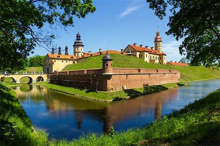 Medieval castle and moat around it in Nesvizh, Belarus. Stockbilder - Microstock & Abonnement, Bildnummer: 400-06140806