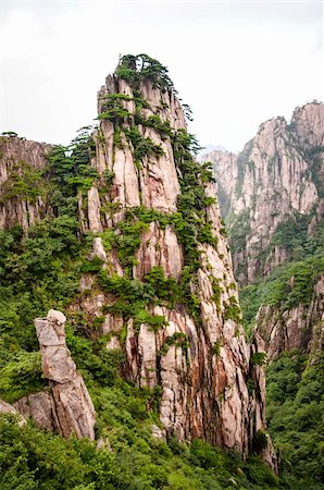 Huangshan mountain peak in a valley in China Stock Photo - Budget Royalty-Free & Subscription, Code: 400-06141086