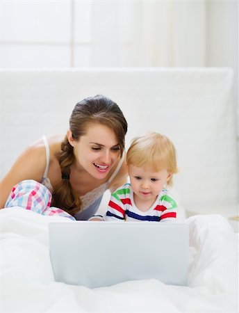 Mother and baby playing with laptop Stock Photo - Budget Royalty-Free & Subscription, Code: 400-06141161