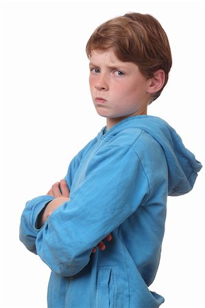 Portrait of an angry young boy on white background Photographie de stock - Aubaine LD & Abonnement, Code: 400-06141384