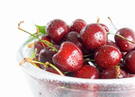 simsearch:400-08110532,k - Fresh ripe cherries in a class bowl close-up isolated on white background. Stock Photo - Budget Royalty-Free & Subscription, Code: 400-06141654