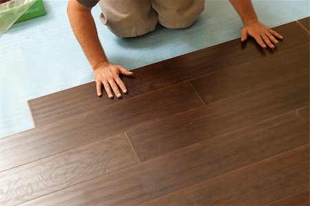 Man Installing New Laminate Wood Flooring Abstract. Stock Photo - Budget Royalty-Free & Subscription, Code: 400-06142078