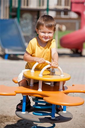 simsearch:400-06737087,k - boy toddler is having fun in the playground Fotografie stock - Microstock e Abbonamento, Codice: 400-06142201