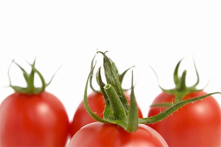simsearch:400-04753423,k - Four fresh tomatoes isolated on white background Photographie de stock - Aubaine LD & Abonnement, Code: 400-06142337