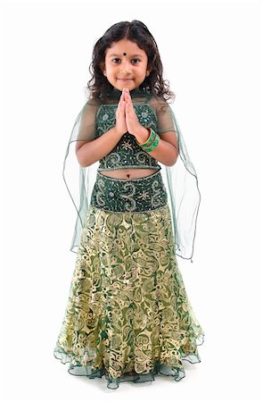photos of little girl praying - Cute little Indian girl in a greeting pose, isolated white background Stock Photo - Budget Royalty-Free & Subscription, Code: 400-06142827