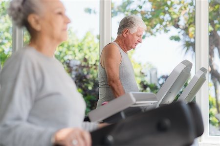 People and sports, elderly couple working out on treadmill in fitness gym Photographie de stock - Aubaine LD & Abonnement, Code: 400-06142950