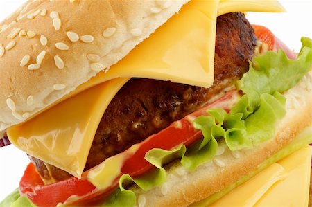 simsearch:400-06330800,k - Tasty Cheeseburger with beef, tomato and letucce closeup clipping path Stock Photo - Budget Royalty-Free & Subscription, Code: 400-06143019