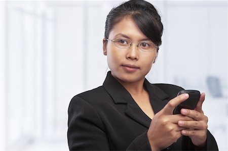 female hand palm - Asian businesswoman looking at blank space in office Photographie de stock - Aubaine LD & Abonnement, Code: 400-06174063