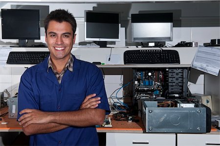 small store - Small business:  owner of a computer repair store Stock Photo - Budget Royalty-Free & Subscription, Code: 400-06174271