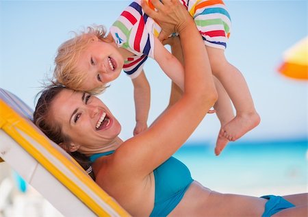 simsearch:400-06639191,k - Portrait of mother playing with baby on beach Stock Photo - Budget Royalty-Free & Subscription, Code: 400-06174346