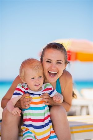 simsearch:400-06639191,k - Portrait of happy mother and baby on beach Stock Photo - Budget Royalty-Free & Subscription, Code: 400-06174350