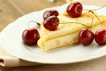 pancake bake - Sweet crepe pancake with  cherries on a wooden table Stock Photo - Budget Royalty-Free & Subscription, Code: 400-06174430