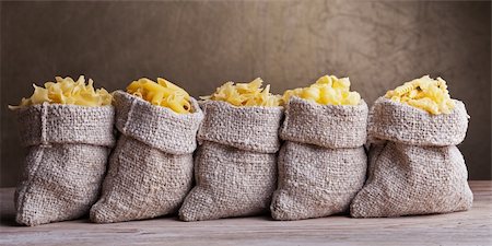 row of sacks - Pasta variety in small burlap sacks in a row Stock Photo - Budget Royalty-Free & Subscription, Code: 400-06174637