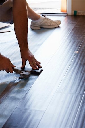 Man Installing New Laminate Wood Flooring Abstract. Stock Photo - Budget Royalty-Free & Subscription, Code: 400-06174956