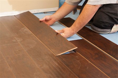 Man Installing New Laminate Wood Flooring Abstract. Stock Photo - Budget Royalty-Free & Subscription, Code: 400-06174959