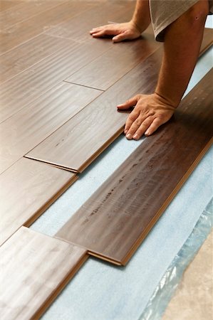 feverpitched (artist) - Man Installing New Laminate Wood Flooring Abstract. Foto de stock - Royalty-Free Super Valor e Assinatura, Número: 400-06174964