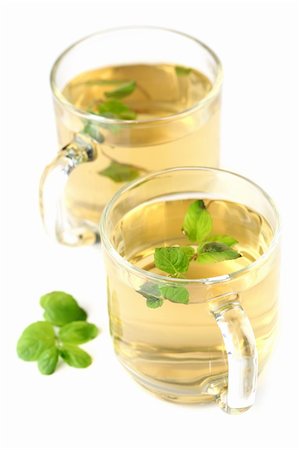 Mint leaf and freshly made mint tea in glass cups isolated on white background. Shallow dof Stock Photo - Budget Royalty-Free & Subscription, Code: 400-06175139