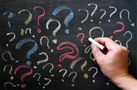 pictures of confused teachers at black board - Question marks on chalkboard. Decision, confusion, FAQ or other concept. Hand writing with chalk on school black board. Stock Photo - Budget Royalty-Free & Subscription, Code: 400-06175570