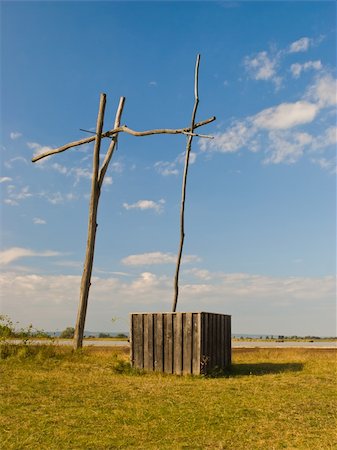 simsearch:400-07576056,k - Old wooden well in dry prairie land Foto de stock - Super Valor sin royalties y Suscripción, Código: 400-06175858