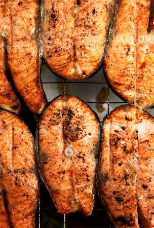 salmon steak on bbq - Fried sea fish. Preparation on open fire Stock Photo - Budget Royalty-Free & Subscription, Code: 400-06177005