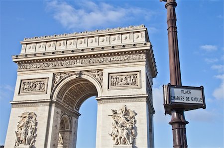 simsearch:400-06076687,k - The Arc de Triomphe (Arc de Triomphe de l'Ã?toile) is one of the most famous monuments in Paris. It stands in the centre of the Place Charles de Gaulle, at the western end of the Champs-Ã?lysÃ©es Foto de stock - Super Valor sin royalties y Suscripción, Código: 400-06177243