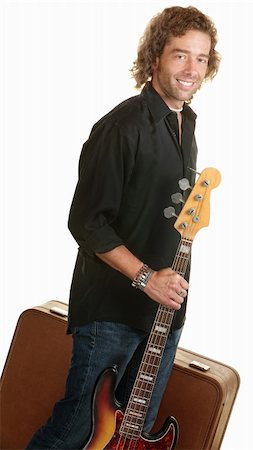 Smiling musician holding guitar and brown suitcase Stock Photo - Budget Royalty-Free & Subscription, Code: 400-06177447