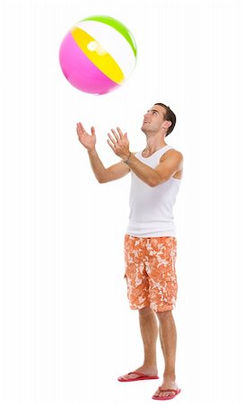 simsearch:400-04766687,k - Resting on vacation happy young man throwing beach ball up Foto de stock - Super Valor sin royalties y Suscripción, Código: 400-06177608