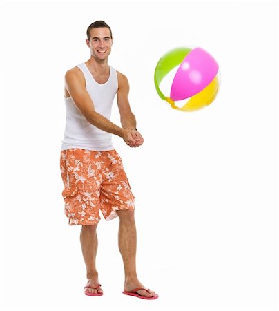 simsearch:400-04766687,k - On vacation happy young man playing volleyball with beach ball Foto de stock - Super Valor sin royalties y Suscripción, Código: 400-06177611