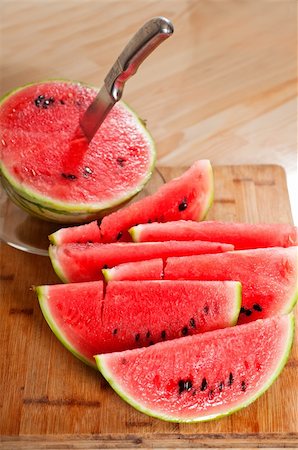 simsearch:400-05717203,k - fresh ripe watermelon sliced on a  wood table with knife Stock Photo - Budget Royalty-Free & Subscription, Code: 400-06177766
