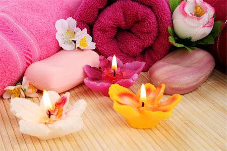 simsearch:400-06564793,k - Towels, soaps, flowers and candles on mat background. Photographie de stock - Aubaine LD & Abonnement, Code: 400-06177960