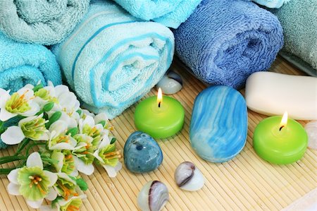 simsearch:400-06564793,k - Stack of towels, candles, stones, flowers on mat background. Photographie de stock - Aubaine LD & Abonnement, Code: 400-06177963