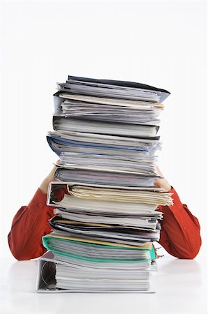 Pile of paperworks with stress businessman on back, over white background Stock Photo - Budget Royalty-Free & Subscription, Code: 400-06177987