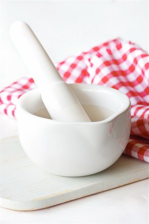 food labratory - White ceramic mortar and pestle on a wooden board. Stock Photo - Budget Royalty-Free & Subscription, Code: 400-06178044