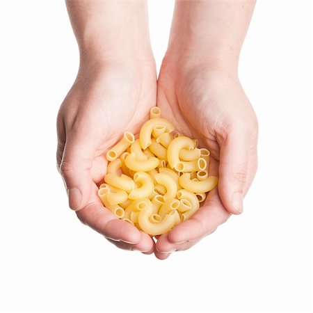 Cupped hands with pasta isolated on white Stock Photo - Budget Royalty-Free & Subscription, Code: 400-06178274