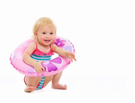swim suit white background sitting - Baby girl in swimsuit sitting with inflatable ring Stock Photo - Budget Royalty-Free & Subscription, Code: 400-06178700