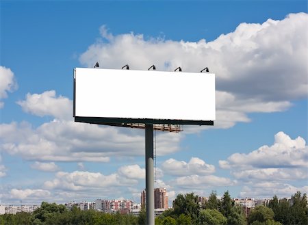 Blank billboard on blue sky background, put your text here Fotografie stock - Microstock e Abbonamento, Codice: 400-06179063