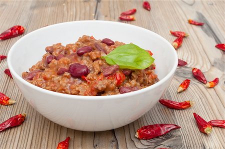 Chilli Con Carne in White Bowl and Red Chili Peppers Stock Photo - Budget Royalty-Free & Subscription, Code: 400-06179105