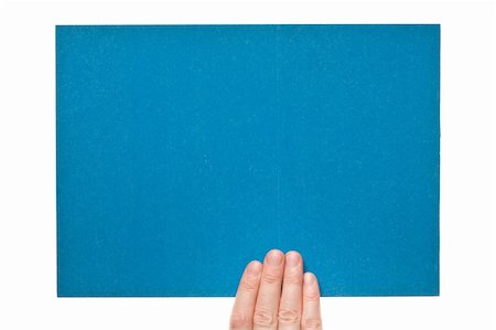 simsearch:400-06137807,k - Blue rough paper in woman hand isolated on white background Foto de stock - Super Valor sin royalties y Suscripción, Código: 400-06179207