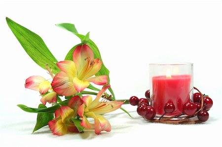 yellow and red Alstroemeria and red candle on white background Stock Photo - Budget Royalty-Free & Subscription, Code: 400-06179443