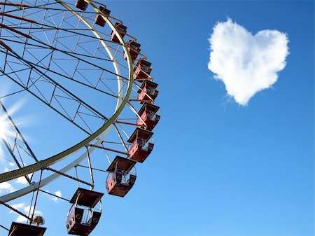 Cloud in the form of hearts and a Ferris wheel on the blue clear sky Stock Photo - Budget Royalty-Free & Subscription, Code: 400-06179748