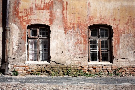 Aged weathered street wall with some windows Stock Photo - Budget Royalty-Free & Subscription, Code: 400-06179961