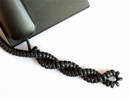 simsearch:400-07516047,k - Black spiral telephone cable on white background Stockbilder - Microstock & Abonnement, Bildnummer: 400-06170425