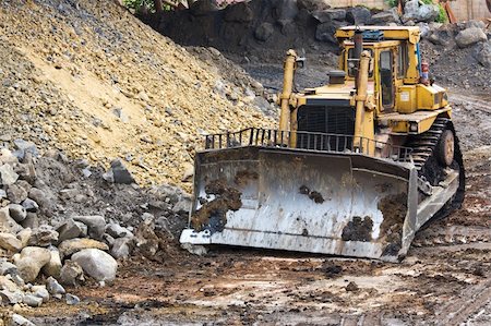 Bulldozer machine doing earthmoving work in mining Photographie de stock - Aubaine LD & Abonnement, Code: 400-06171776